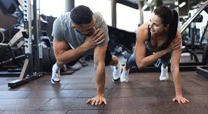 Sculpting Sleek Arms: The Essential Role of Cardio in Toning Without Bulking Up 1 Image of man and woman doing Cardio Daventry to tone their arms.